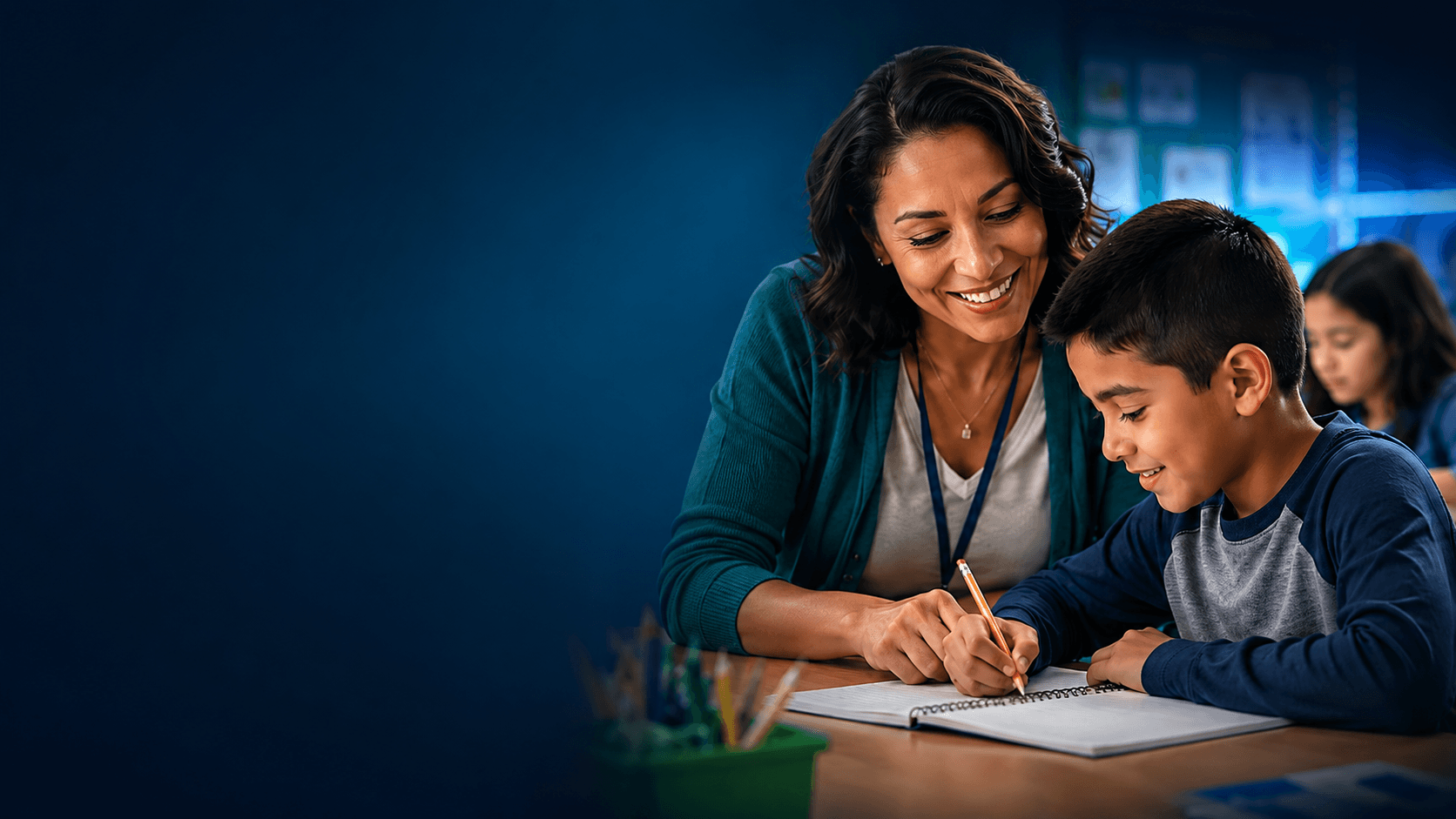 A paraprofessional helping a student at a classroom table